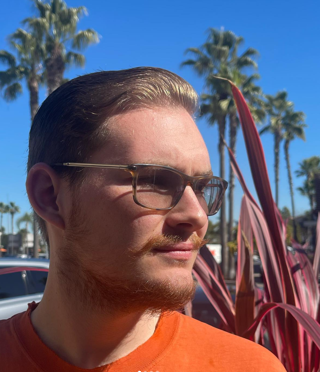 Short men's haircut swept to the side